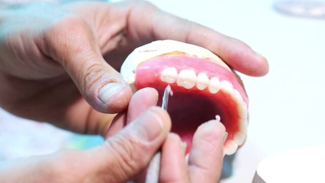 Crafting precision in dental prosthetics, a close-up view of denture fabrication