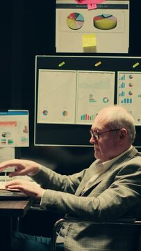 Vertical Video Detectives team comparing witness statements in investigations, reopening old case files to cross reference data and search for connections. Paralyzed inspector works with law agent