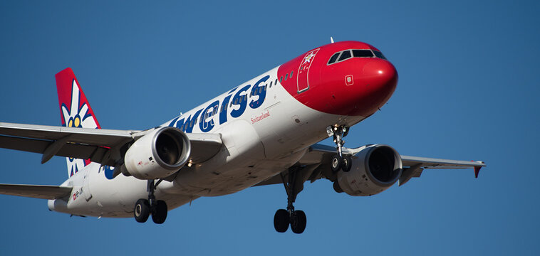 Tenerife, Spain February 18 st, 2024. Airbus A320-214 Edelweiss Air Airlines flies in the blue sky. Landing at Tenerife Airport