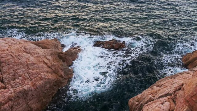 Waves crushing on rocks