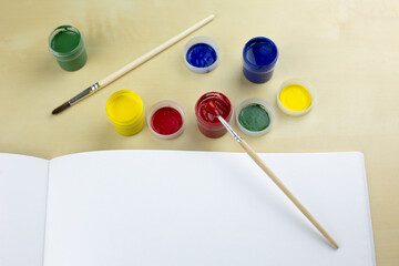 Sketchbook with gouache paints