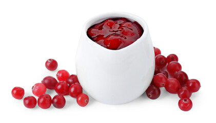 Cranberry sauce in pitcher and fresh berries isolated on white