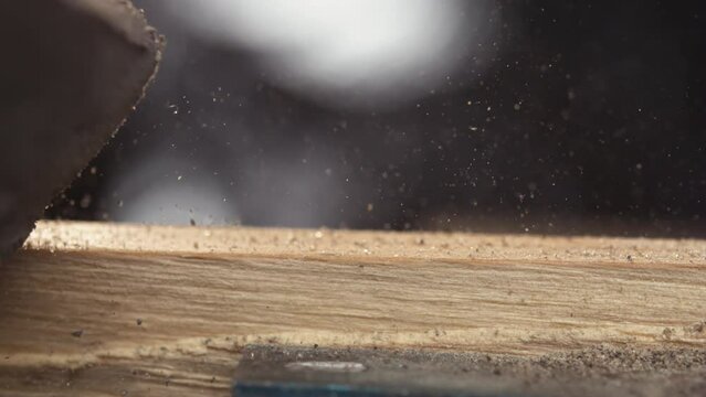 Witness the serene process of wood sanding in slow motion, unveiling its natural beauty with each graceful stroke.