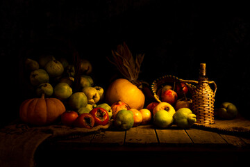 Autumn still life with different fruits such as pumpkin, grapefruit, pomegranate, corn and...