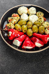 antipasti mix olives, mozzarella, stuffed peppers, mushrooms antipasto fresh food tasty eating appetizer meal food snack on the table copy space food background