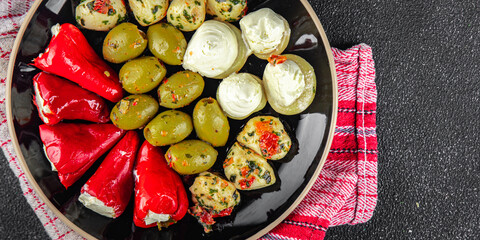 antipasti mix olives, mozzarella, stuffed peppers, mushrooms antipasto fresh food tasty eating appetizer meal food snack on the table copy space food background