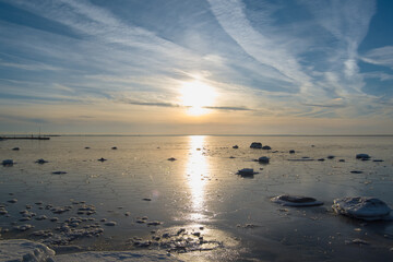 The Baltic Sea is frozen on a sunny day.