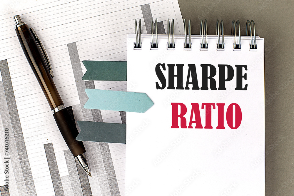 Aufkleber sharpe ratio text on notebook with pen, calculator and chart on a grey background