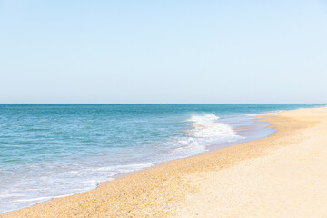 Fototapeta na wymiar Soft blue sea and ocean wave on clean sandy beach. Summer vacation concept.