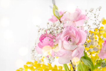 Obraz na płótnie Canvas Ranunculus, willow, mimosa and gypsophila spring flowers bouquet