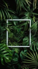 Layers of green a white frame's perspective on tropical foliage, creative layout card note nature concept
