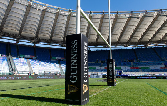 Empty rugby stadium with goal posts and Guinness sponsor branding, Olympic stadium, Rome