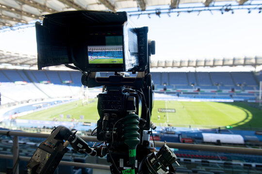 Professional video camera capturing empty stadium