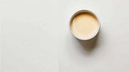Obraz na płótnie Canvas Bowl of cream on white background