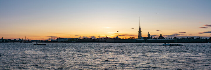 view from the palace embankment of the Peter and Paul Fortress at sunset