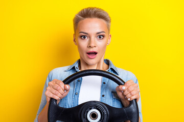 Photo portrait of attractive young woman hold shocked steering wheel dressed stylish denim clothes...