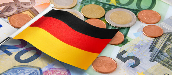 Euro banknotes and coins with German Flag