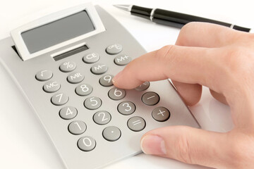 Male hand and calculator on white background