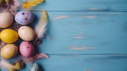Easter banner with painted eggs and feathers on a blue wooden background. Place for text