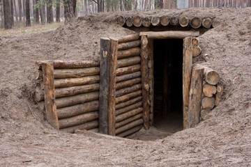 military dugout in the pine forest - 740736665