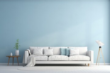 Modern living room with white sofa, blue wall and green plant.