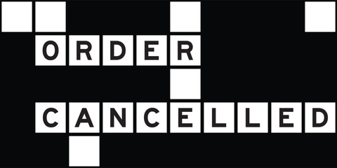 Alphabet letter in word order cancelled on crossword puzzle background