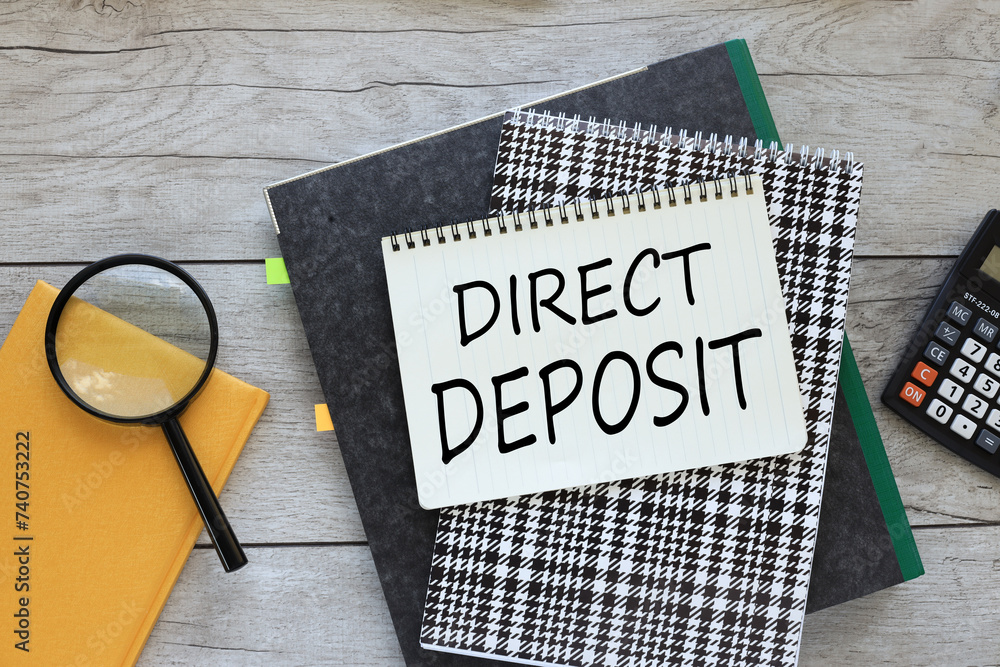 Poster direct deposit text on notepad page. workspace with folder