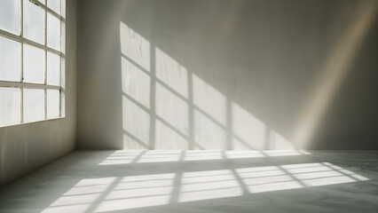 Fototapeta premium Trace of Tranquility: Monotone Light Rays and Shadows on a White Wall