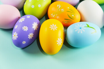 Colorful Easter eggs on green colored background copy space stock photo