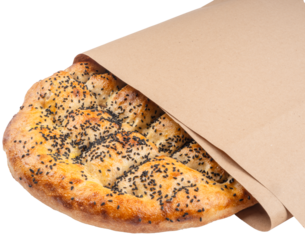 Traditional special Turkish bread called Ramazan Pide wrapped Kraft paper. Holy month Ramadan pita concept idea image. Isolated transparent png background.