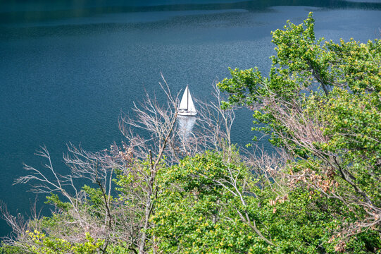 View of the Lake Edersee with a sailboat