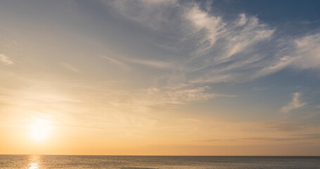Naklejka na ściany i meble sunset sky over the sea in the evening with orange sunlight, Horizon sea landscape background 