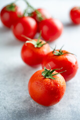 Fresh and ripe tomatoes on white background