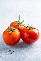 Fresh and ripe tomatoes on white background