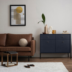 Interior design of harmonized living room with brown sofa, blue commode, coffee table, mock up...