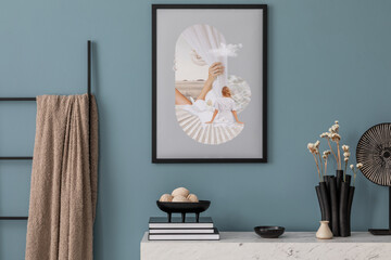 Minimalist composition of living room interior with blue background, black poster frame mock up,...