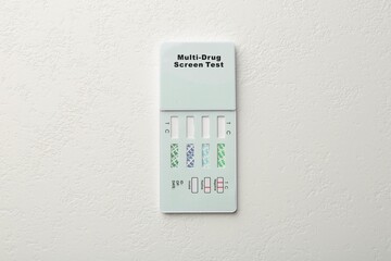 Multi-drug screen test on white textured table, top view