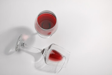 Tasty red wine in glasses isolated on white