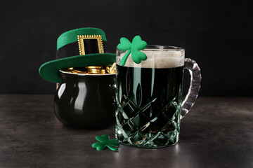 St. Patrick's day celebration. Green beer, leprechaun hat, pot of gold and decorative clover leaves...