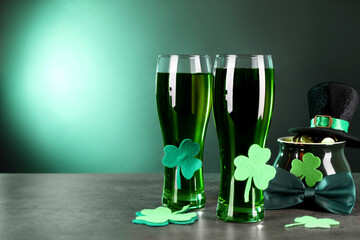 St. Patrick's day celebration. Green beer, leprechaun hat, pot of gold and decorative clover leaves...