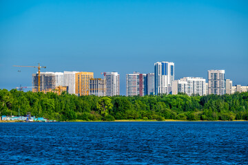 New high-rise apartment buildings on the lake shore.