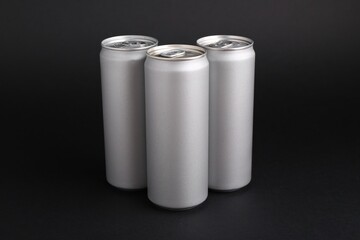 Energy drinks in cans on black background
