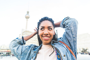 Joyful young black woman in urban setting
