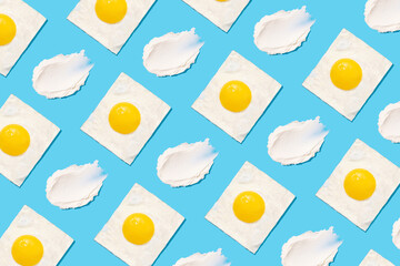 Egg pattern on blue background. Creative food concept, morning breakfast brunch concept. Modern minimal food photography collage