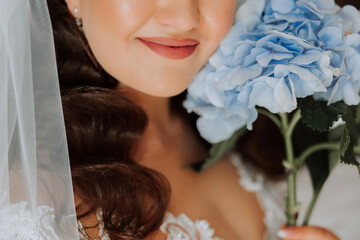 hydrangea flower in the hands of the bride. Wedding details. The first meeting of the bride and groom. The bride is waiting for the groom. Portrait of the bride.