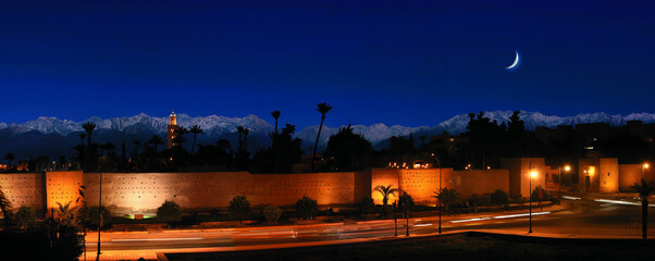 marrakesh at night with mountains in the background