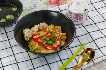 Egg noodles with wonton and red roasted pork, Asian food style