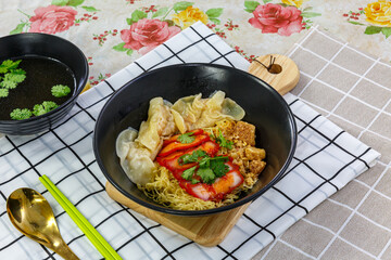 Egg noodles with wonton and red roasted pork, Asian food style