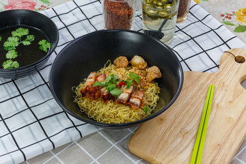 Egg noodles with crispy pork, Asian food style