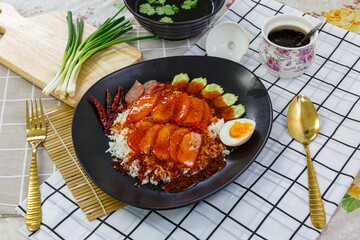 Barbecued red pork in sauce with rice
